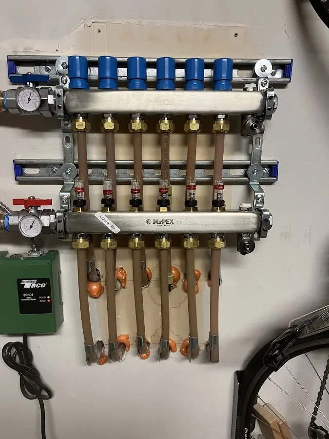 Plumber performing Water Heater Repair at a residential property in Bloomer